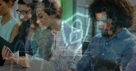 Image of digital shield with padlock over happy diverse female and male coworkers. Business, data...