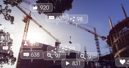 Image of social media icons and numbers on banners over construction site. global networking, social media, technology and digital interface concept digitally generated image.の写真素材