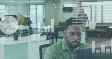 Image of financial data processing over businessman using computer in office. global business, data processing and digital interface concept digitally generated image.の写真素材