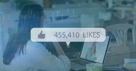 Image of media icon and data processing over biracial businesswoman having image call. Global business and digital interface concept digitally generated image.の写真素材