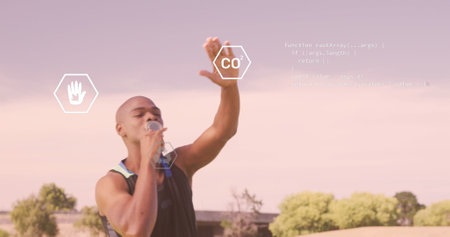 Image of digital icons and data processing over african american male athlete kissing his medal. Sports technology conceptの写真素材