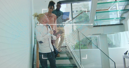 Image of fingerprint in viewfinder over diverse coworkers sharing ideas while walking downstairs....