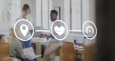 Image of icons connected with lines over diverse coworkers sharing ideas in office. Digital...