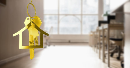 Image of hanging golden house keys against interior of a classroom. Interior designing and real estate conceptの写真素材