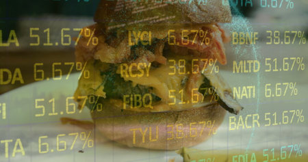 Image of financial data processing over sandwich. Global business, finances, computing and data processing concept digitally generated image.の写真素材