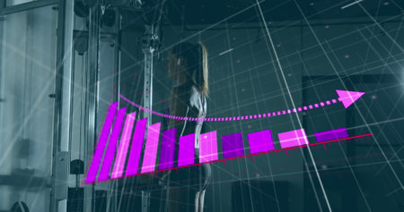 Image of arrow on bar graph over asian woman performing exercise in gym. Digital composite, multiple exposure, report, business, growth, wellness and fitness concept.の写真素材