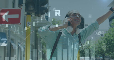 Image of graphs , changing number, biracial man calling on cellphone and raising hand. Digital...