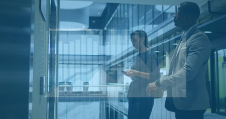 Image of graphs, diverse man looking at watch and woman using phone while waiting for elevator....