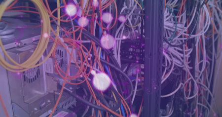 Colorful cables and lights filling server racks with vibrant hues. Connecting and powering devices, ensuring smooth operationsの写真素材