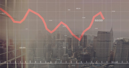 Red line graph showing decline, overlaying cityscape. Buildings in red background fading into foggy haze, creating mysterious atmosphereの写真素材