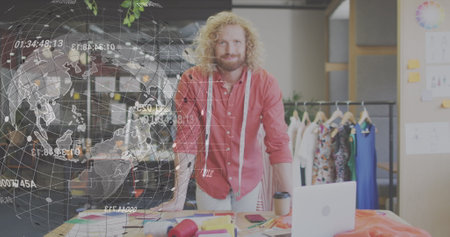 Image of globe with data processing over caucasian male designer. Global business, finances and digital interface concept digitally generated image.の写真素材