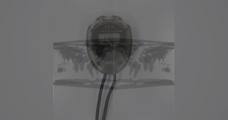 Image of world map in a cube spinning against close up of a stopwatch on grey background. Global sports tournament conceptの写真素材