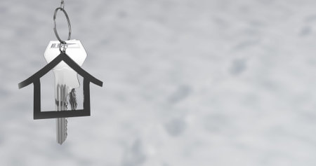 Image of silver key with house keychain on grey background. Abstract background, pattern and movement concept, digitally generated image.の写真素材