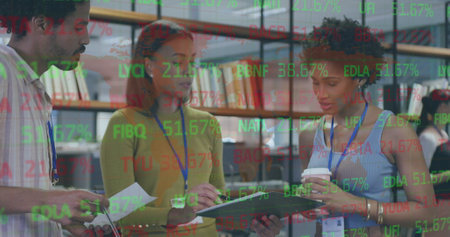 Image of stock market data processing over diverse colleagues discussing over document at office. Global economy and business technology conceptの写真素材