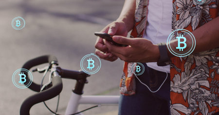 Image of bitcoin icons, data processing over african american man using smartphone. Global cryptocurrency, business, computing, data processing and connections concept digitally generated image.の写真素材