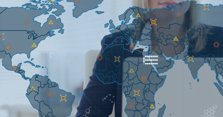 Image of financial data processing with world map over caucasian businesswoman using laptop. Global...