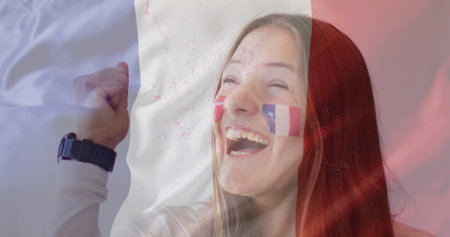 Image of flag of france over caucasian woman smiling. Bastille day, fete nationale francaise, patriotism and celebration concept digitally generated image.の写真素材