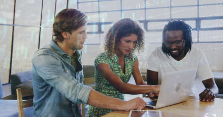 Image of multiple graphs and trading board, diverse coworkers discussing reports on laptop. Digital...