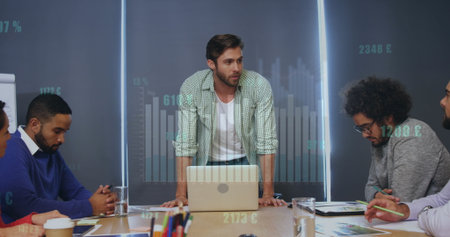 Image of graphs, changing numbers, currency symbols, diverse coworkers discussing reports. Digital...
