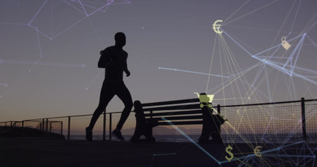 Image of connected icon globe over silhouette of african american man running at beach. Digital...