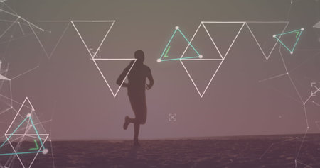 Image of multiple triangles over silhouette of african american man running on beach. Digital composite, multiple exposure, shape, training, health and fitness concept.の写真素材