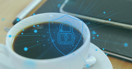 Image of padlock in shield over coffee cup, pen and cellphone on notepad. Digital composite, multiple exposure, protection, security, beverage, abstract and technology concept.の写真素材