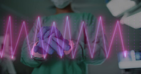 Image of heart rate monitor against mid section of male surgeon wearing surgical gloves. Medical healthcare and research science technology conceptの写真素材