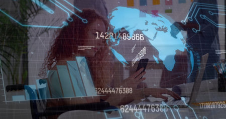 Image of graph, globe, number, coding over caucasian businesswoman using smartphone and laptop. Digital composite, business, report, globalization, data processing, technology, office.の写真素材