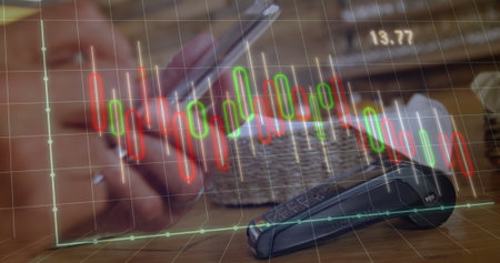 Image of graphs and changing numbers over biracial man paying bill using nfc technology. Digital...