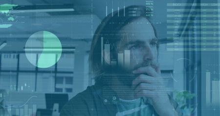 Image of data processsing against thoughtful caucasian man looking out of window at office. Computer...