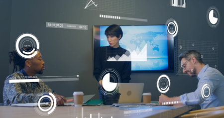Image of statistical data processing against diverse colleagues discussing together at office. Computer interface and business data technology conceptの写真素材