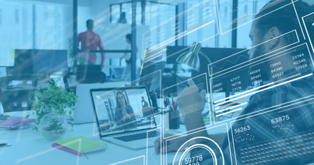 Image of financial data processing over biracial businessman in office. Global business, finances, computing and data processing concept digitally generated image.の写真素材