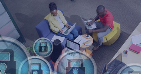 Image of padlock in circles, overhead view of diverse coworkers planning strategy in office. Digital...