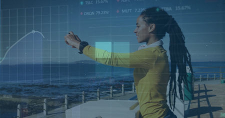 Image of squares, graphs and trading boards over biracial taking sea image using cellphone. Digital composite, multiple exposure, report, business, shape, stock market and technology concept.の写真素材
