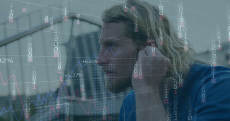 Image of falling binary codes, graphs, changing numbers, caucasian man adjusting headphones. Digital composite, multiple exposure, report, business, growth, computer language and technology.の写真素材