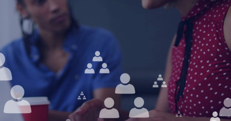 Image of data processing over african american businesswoman using laptop in office. Global finance, business and data processing concept digitally generated image.の写真素材