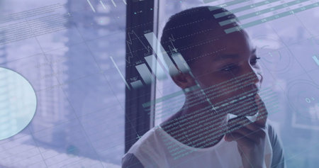 Image of financial data processing over african american businesswoman. Global business, connections, computing and data processing concept digitally generated image.の写真素材