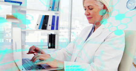 Image of scientific data processing over caucasian female scientist with laptop. Global science, research, computing and data processing concept digitally generated image.の写真素材