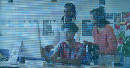 Image of looping binary codes over diverse coworkers discussing reports on desktop in office. Digital composite, multiple exposure, computer language, teamwork, planning and technology concept.の写真素材
