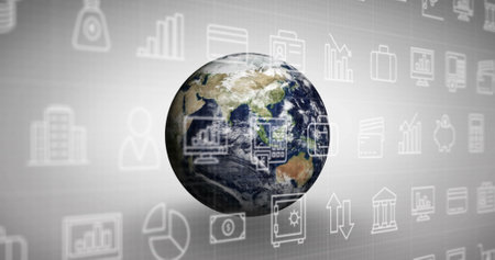 The global economy concept with a digitally generated image of a revolving earth on a grey...