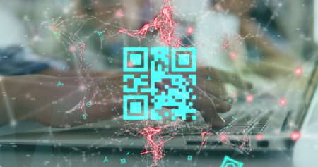 Image of qr code scanner over mid section of a woman using a laptop at office. Digital payments and business technology conceptの写真素材