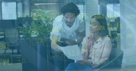 Image of stock market data processing over diverse male and female colleagues discussing. Global...