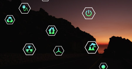 Image of sustainability and ecology icons over landscape. Ecology, sustainability and data processing concept digitally generated imageの写真素材