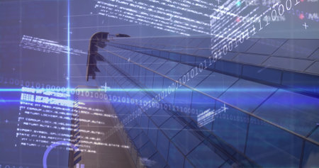 Image of stock market data processing and light trails against low angle view of tall building....