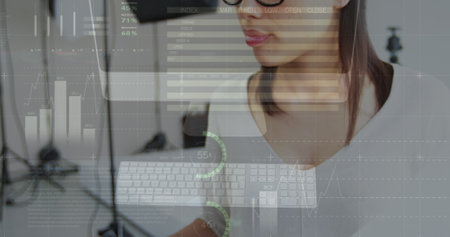 Image of infographic interface over camera and biracial woman checking profile pictures. Digital composite, multiple exposure, report, business, progress, global and technology concept.の写真素材