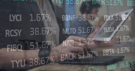 Image of stock market data processing against mid section of a woman using graphic tablet. Global...