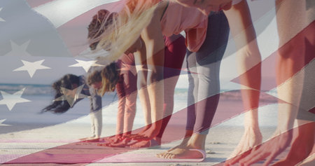 Image of american flag over diverse women exercising at beach. patriotism and celebration concept digitally generated image.の写真素材