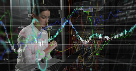 Image of financial data processing over caucasian businesswoman in server room. global business,...