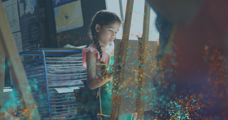 Image of light spots over diverse schoolchildren painting. children's art week, education and digital interface concept digitally generated image.の写真素材