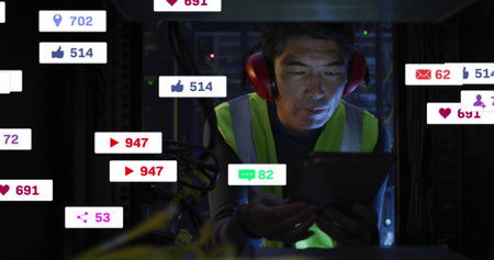 Image of social media icons and numbers over asian male it technician by computer server. Global...